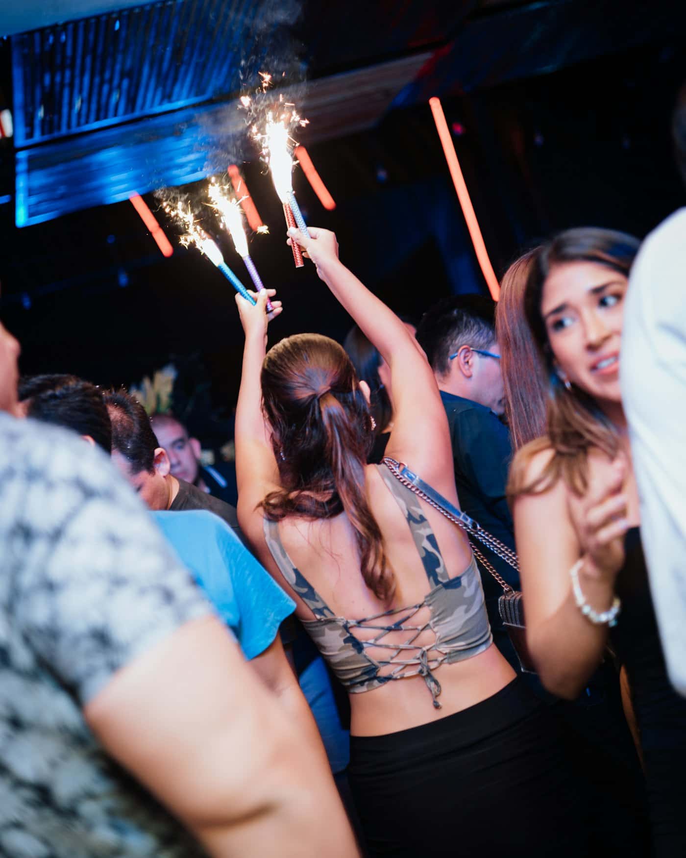 Guests celebrating with sparklers at a night event